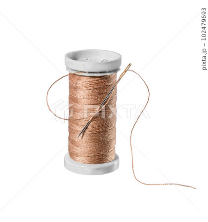 Thread spool on white. 102479693