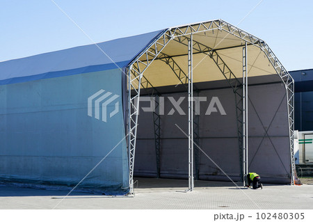 Unfinished large prefabricated arched metal frame tent hangar covered with polyvinyl chloride fabric Unfinished large prefabricated arched metal frame tent hangar covered with polyvinyl chloride fabric 102480305