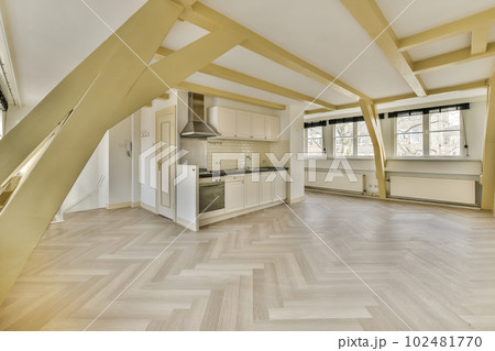 an empty room with wood flooring and white cabinets in the room is very spacious, but it's not too 102481770