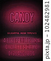 Candy sign and pink neon narrow font with numbers on vector dark brick wall background. Passionate night light alphabet glow effect 102482981