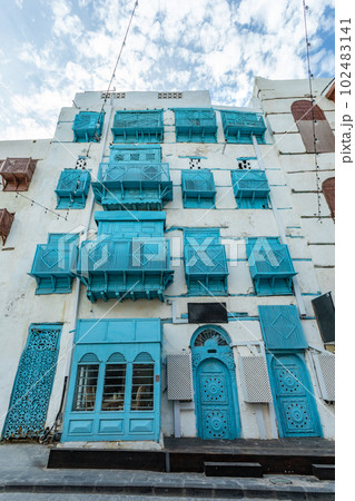 Al-Balad old town with traditional muslim houses with blue windows and balconies, Jeddah, Saudi Arabia 102483141