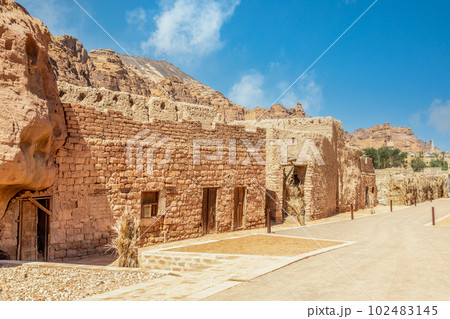 Al Ula old town street with ruined mud huts, Medina province, Saudi Arabia 102483145