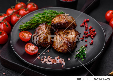 Delicious grilled meat in the form of a kebab with spices and herbs 102484329