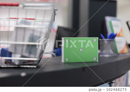 Empty drugstore with green screen mock up chroma key packages package standing on pharmacy counter desk. Health care store filled with pharmaceutical products and drugs bottles Empty drugstore with green screen mock up chroma key packages package standing on pharmacy counter desk. Health care store filled with pharmaceutical products and drugs bottles 102488273