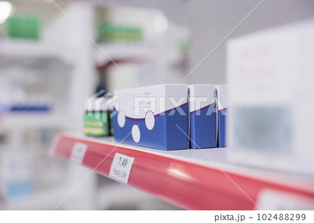 Drugstore with shelves full of rows of pharmaceutical products packages and modern medicine, used by clients to buy healthcare drugs and pharmaceutical products. Pharmacy concept Drugstore with shelves full of rows of pharmaceutical products packages and modern medicine, used by clients to buy healthcare drugs and pharmaceutical products. Pharmacy concept 102488299