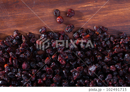 Dehydrated blueberries on wood surface. Natural food background 102491715