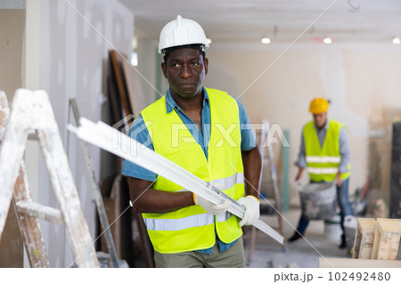 Repairman working in construction site in apartment 102492480