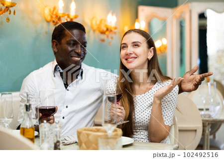 Couple at dinner at cozy restaurant 102492516