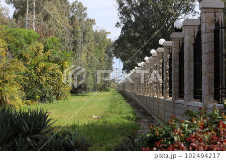fence in a city park in northern Israel 102494217