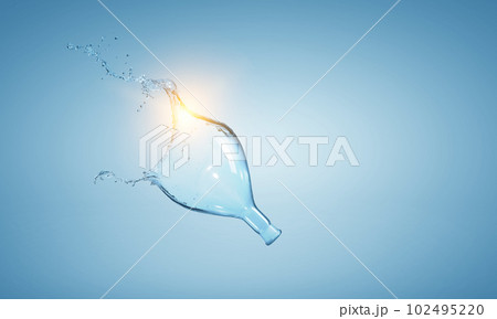 Water splash out of glass bottle Water splash out of glass bottle 102495220