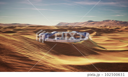 futuristic glass building in desert dunes futuristic glass building in desert dunes 102500631