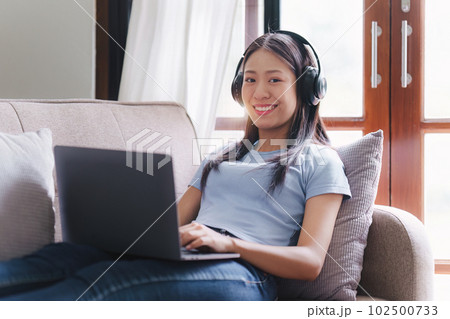 Attractive Asian woman resting comfortable living room and using laptop computer, Relax, Sofa, Lifestyle Attractive Asian woman resting comfortable living room and using laptop computer, Relax, Sofa, Lifestyle 102500733