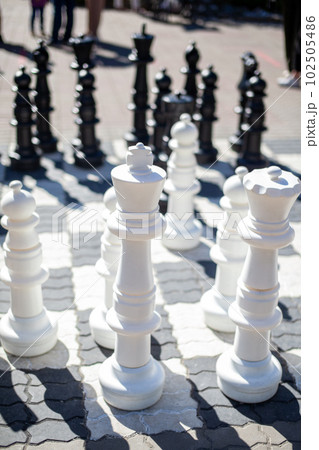 Close up big pieces and giant chess board of street chess in the park Close up big pieces and giant chess board of street chess in the park 102505486