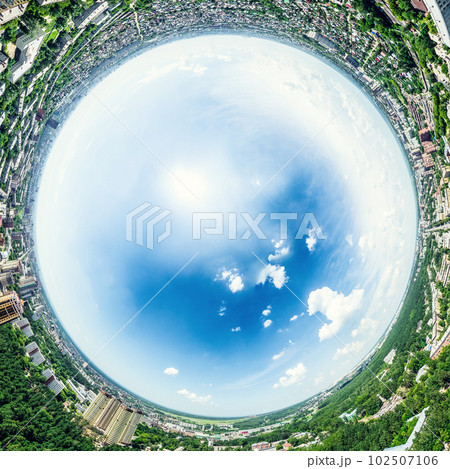 Aerial city view with crossroads and roads, houses, buildings, parks and parking lots. Sunny summer panoramic image 102507106