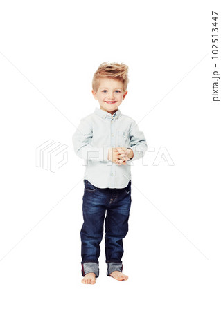 Happy, fashion and portrait of a child in jeans isolated on a white background in a studio. Smile, cute and a young boy kid with happiness for stylish and fashionable clothes as a toddler model Happy, fashion and portrait of a child in jeans isolated on a white background in a studio. Smile, cute and a young boy kid with happiness for stylish and fashionable clothes as a toddler model 102513447