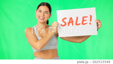 Woman, face and sale poster on green screen, smile and advertising with sign, gym promotion and discount. Portrait, billboard and cardboard with text, happy female with notice on studio background Woman, face and sale poster on green screen, smile and advertising with sign, gym promotion and discount. Portrait, billboard and cardboard with text, happy female with notice on studio background 102513549