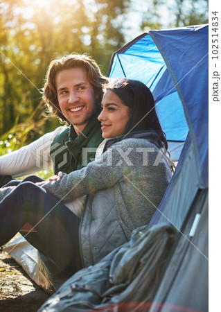 I knew shed love camping. an adventurous young couple at their campsite. 102514834