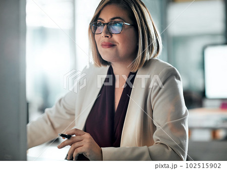 Its imperative to have well defined goals. a businesswoman sitting at her desk. 102515902