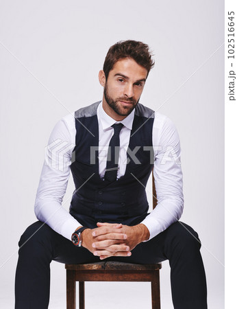 Style is my thing. Studio shot of a handsome and well-dressed young man. Style is my thing. Studio shot of a handsome and well-dressed young man. 102516645