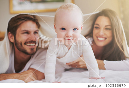 My parents and me. a young couple and their baby daughter in the bedroom. My parents and me. a young couple and their baby daughter in the bedroom. 102516979