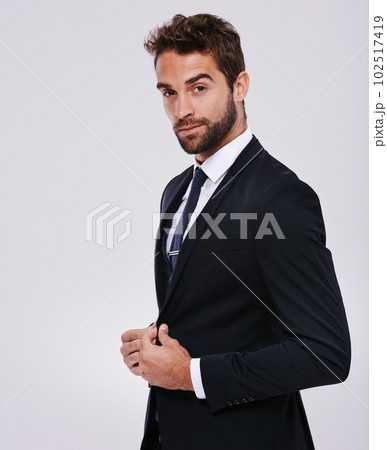 Hes a ladies man. Studio shot of a handsome and well-dressed young man. 102517419