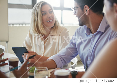 Collaboration is what excites them. a team of business colleagues discussing a project around a table in their office. Collaboration is what excites them. a team of business colleagues discussing a project around a table in their office. 102517602
