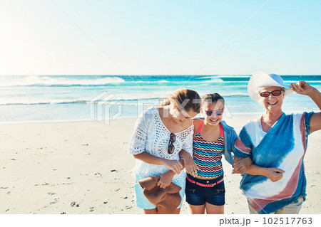 Theres nowhere theyd rather be. a senior woman spending the day at the beach with her daughter and granddaughter. 102517763