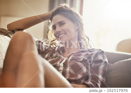 Nothing beats a day indoors. a young woman relaxing on the sofa at home. 102517970