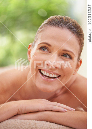 Waiting for the masseuse. a woman in a day spa relaxing on a massage table. 102518587