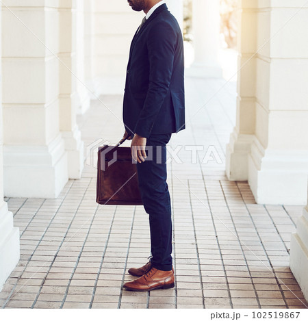 Suit up, theres success to be made. a stylishly dressed businessman in the city. Suit up, theres success to be made. a stylishly dressed businessman in the city. 102519867