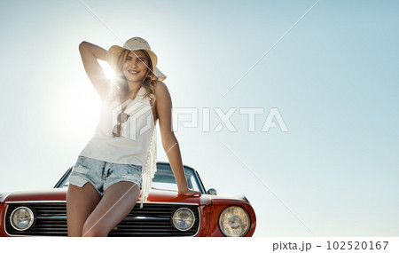 The summer sun is always enjoyable. an attractive young woman on a road trip. The summer sun is always enjoyable. an attractive young woman on a road trip. 102520167