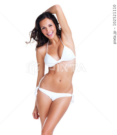 Bikini, happy and portrait of a beautiful woman isolated on a white background in a studio. Smile, sexy and a young swimwear model with confidence, happiness and pride in a swimsuit for summer 102521110