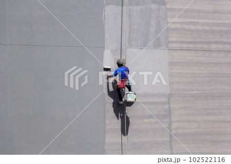 painter hanging on building painter hanging on building 102522116