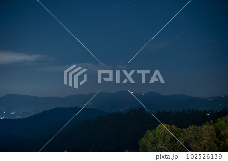 mountain view with night sky and light from downtown background 102526139
