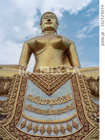The Sacred Buddha is named "Phra Buddhachinnasi" in Wat Khiriwong Temple, which has the blue sky background. The temple is located on the top of the Hill and It is worshiped by people of Pak Nam Pho. The Sacred Buddha is named "Phra Buddhachinnasi" in Wat Khiriwong Temple, which has the blue sky background. The temple is located on the top of the Hill and It is worshiped by people of Pak Nam Pho. 102529054