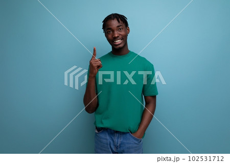 smart american young brunette man in casual t-shirt with inspiration thought smart american young brunette man in casual t-shirt with inspiration thought 102531712