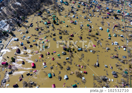 View from a high altitude of flooded houses in the countryside during the spring flood 102532710