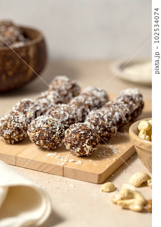 Energy balls. No cook energy protein, bites made from coconut flakes, oats, dried fruits and nuts. 102534074