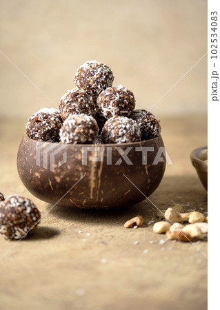Energy balls. No cook energy protein, bites made from coconut flakes, oats, dried fruits and nuts. 102534083