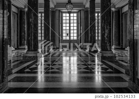 Marble Lobby in the central part of the Palace of Versailles near Paris, France. Black and white photography. Marble Lobby in the central part of the Palace of Versailles near Paris, France. Black and white photography. 102534133