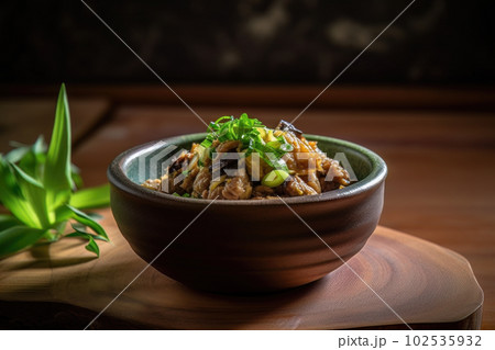 AI generated appetizing Pork Sisig in a dark green bowl AI generated appetizing Pork Sisig in a dark green bowl 102535932