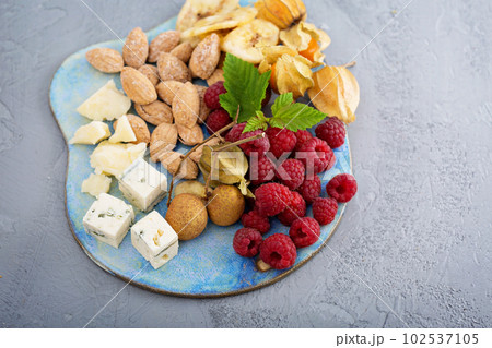 Fruit and nuts cheese board 102537105