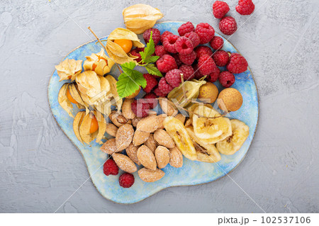 Tropical fruit plate with mango and peaches 102537106