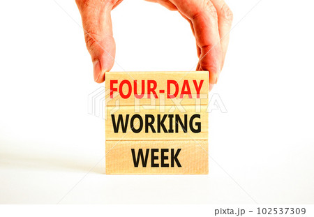 Four-day working week symbol. Concept words Four-day working week on wooden block on a beautiful white table white background. Businessman hand. Business four-day working week concept. Copy space. 102537309