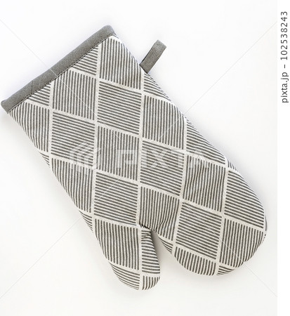 Gray oven glove on a white background. Kitchen potholder. Gray oven glove on a white background. Kitchen potholder. 102538243