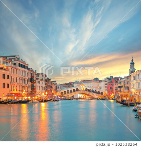 Stunning sunset and evening cityscape of Venice with famous Canal Grande and Rialto Bridge Stunning sunset and evening cityscape of Venice with famous Canal Grande and Rialto Bridge 102538264