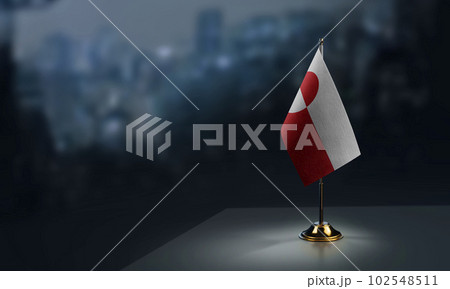 A small Greenland flag on an abstract blurry background A small Greenland flag on an abstract blurry background 102548511