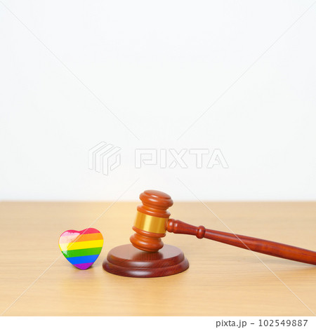 LGBT Law and Pride month concepts. gavel justice hammer with rainbow colorful heart shape for Lesbian, Gay, Bisexual, Transgender, Queer, Intersex, Asexual, Agender, Non Binary, Two Spirit, Pansexual 102549887