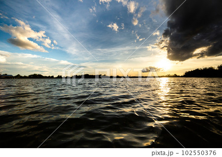 colorful dramatic sky with cloud at sunset. 102550376