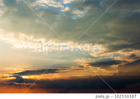 colorful dramatic sky with cloud at sunset. 102550387